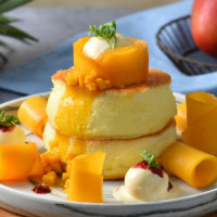 芒果控吃定了！網美最愛的成真咖啡「愛文芒果舒芙蕾」限定登場，16天加碼推買一送一優惠。